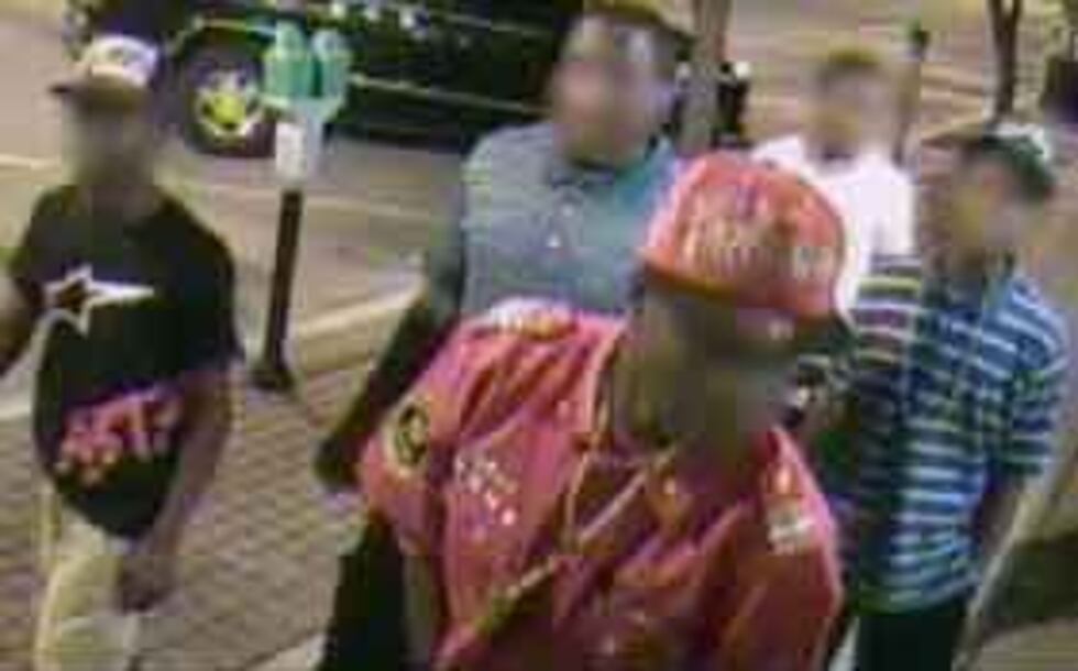 A surveillance photo of five of the suspects (faces have been blurred to protect juveniles'...