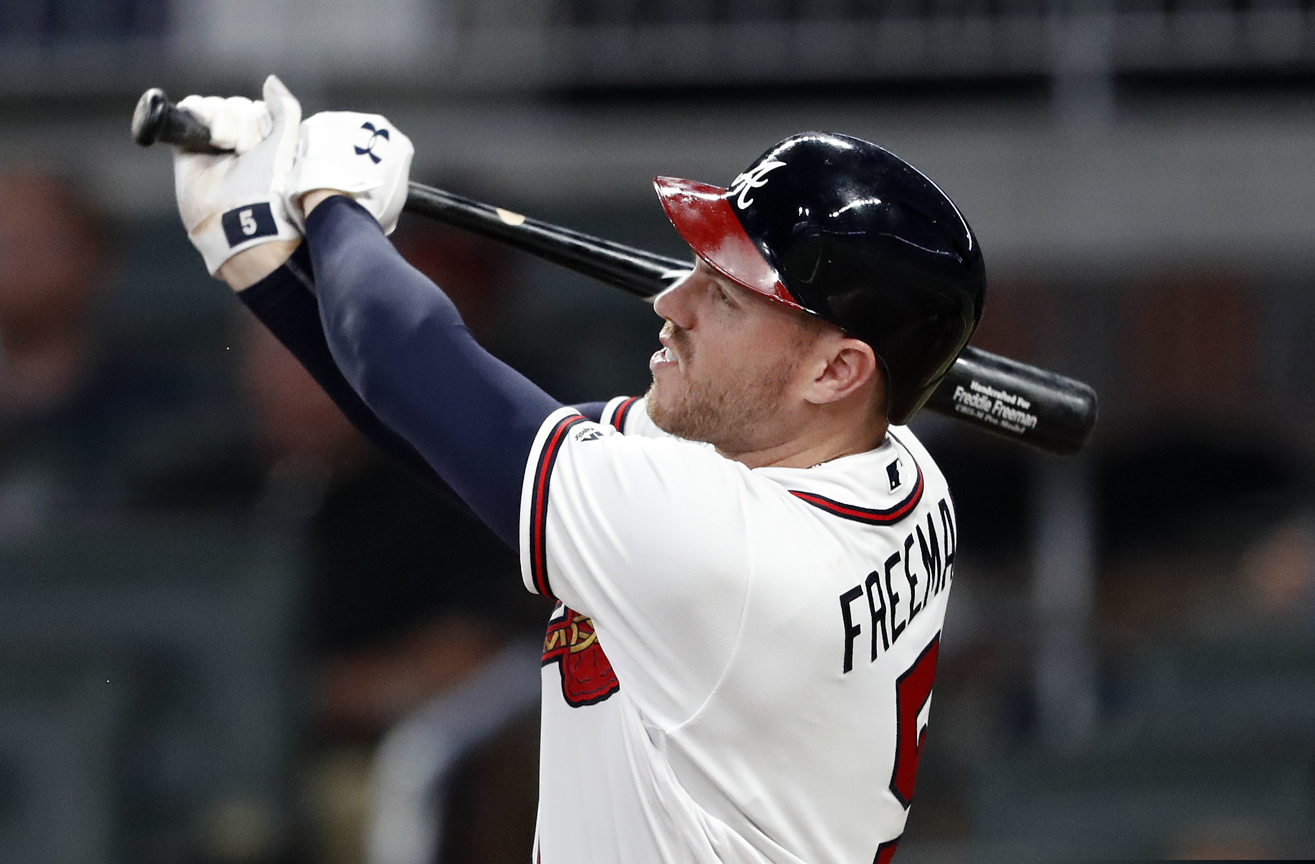Atlanta Braves' Freddie Freeman (5) connects on a solo-home run in the sixth inning of a...