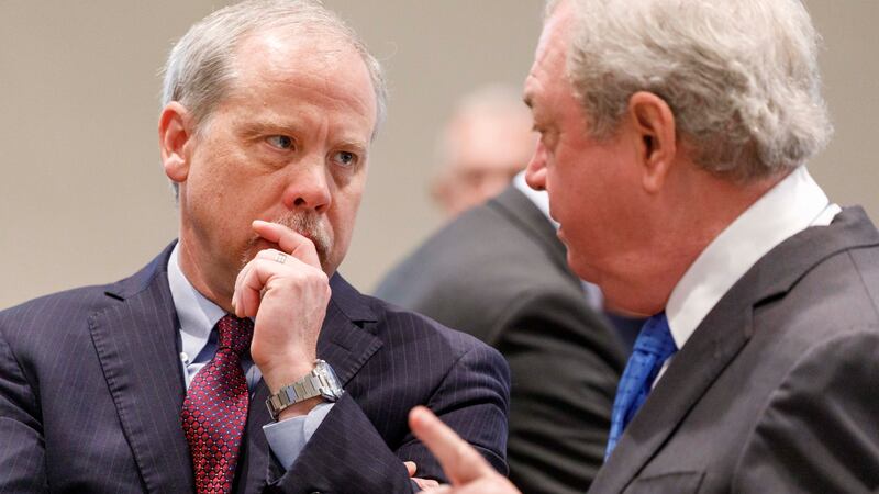 Chief prosecuting attorney Creighton Waters,left, talks with defense attorney Dick Harpootlian...