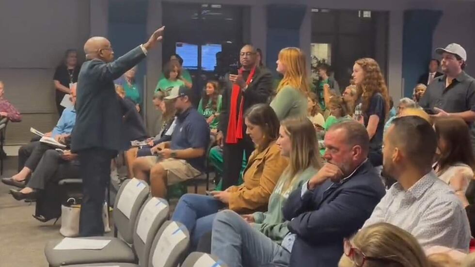 The Rev. Nelson Rivers III (left), refused to stop speaking at Monday night's Charleston...