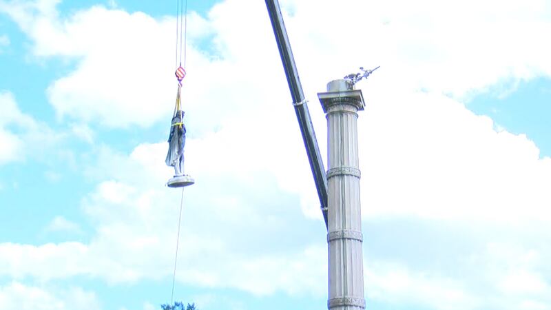 After more than 17 hours, workers have brought down the statue of former United States Vice...