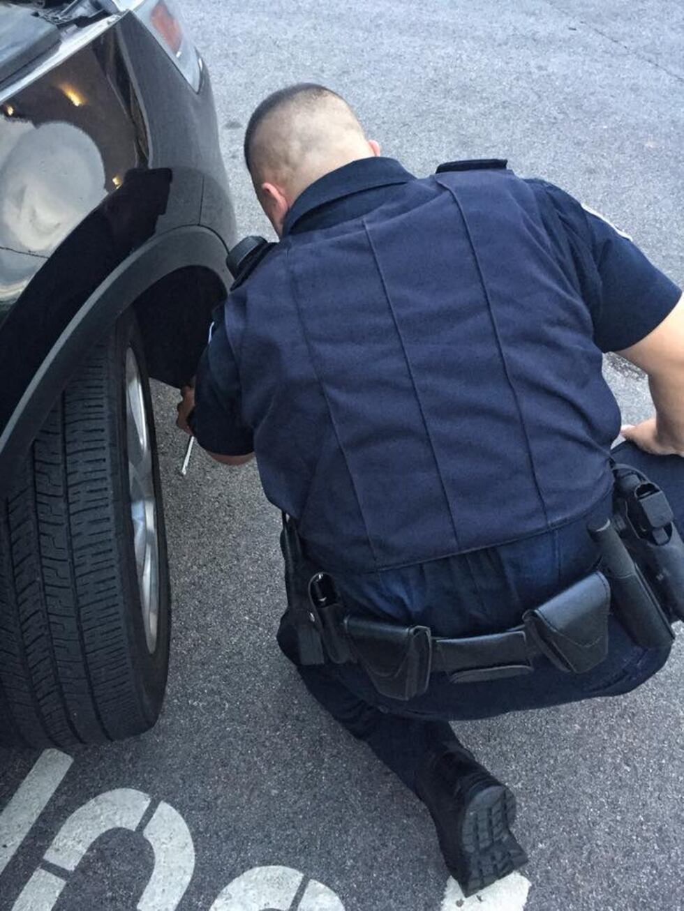 Officer Justin Carrabetta was able to rescue the kitty by taking the wheel well apart. (Twitter)