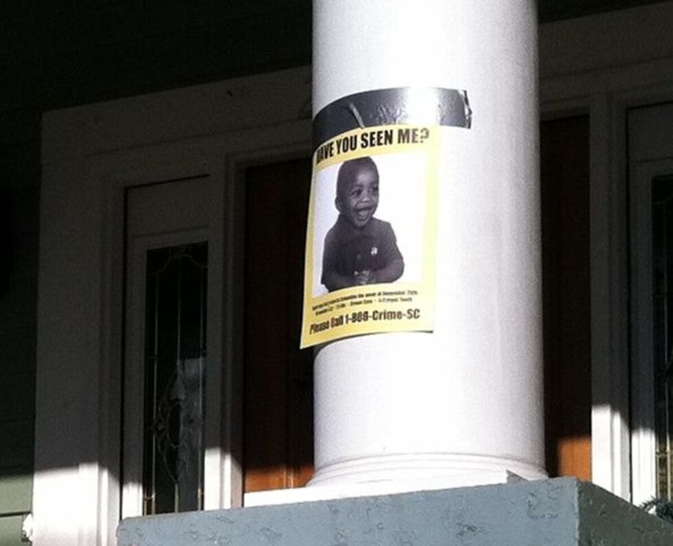 A missing poster hangs on the front of Jocelyn Jennings Nelson's home.