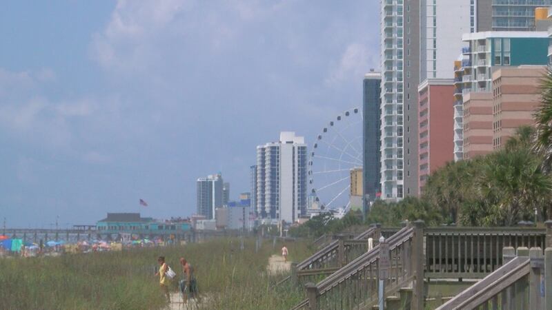 Beach goers head to the shore near 23rd Avenue.