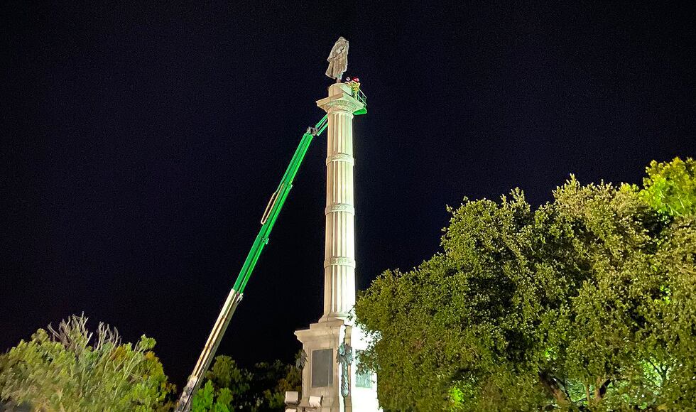 Crews in the process of removing the Calhoun statue in Marion Square in downtown Charleston.