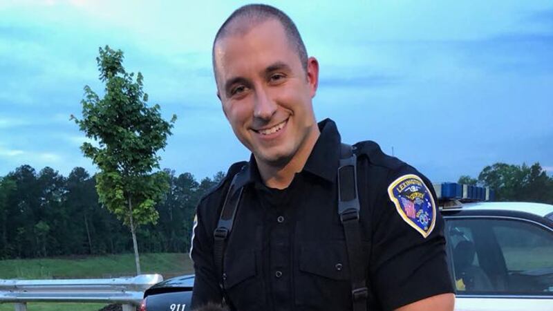 Corporal Dustin Currier found a kitten trapped in his patrol vehicle engine and Officer Justin...